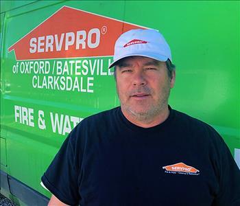 Ronnie McDaniel stands in front of a SERVPRO of Oxford/Batesville/Clarksdale work vehicle