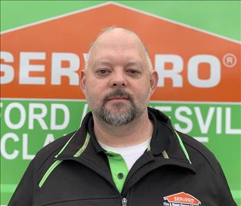 Nat Homan stands in front of the SERVPRO of Oxford/Batesville/Clarksdale work vehicle.