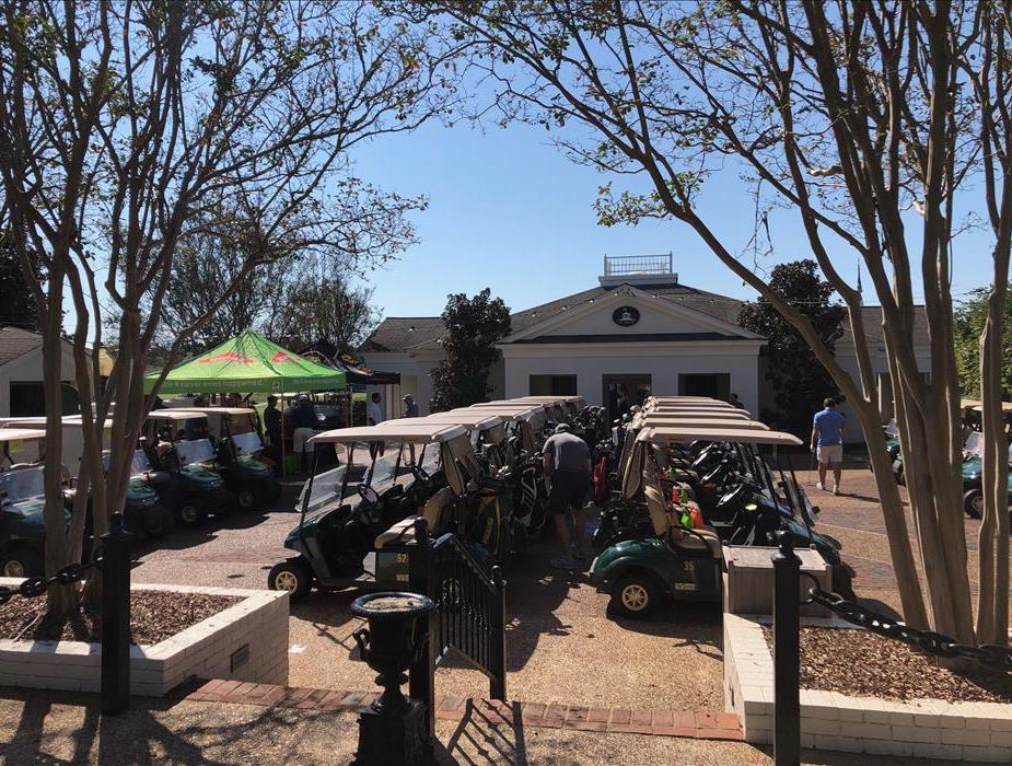 Overview of the golf carts and SERVPRO tent at the 14th Annual SERVPRO of Mississippi Golf Tournament
