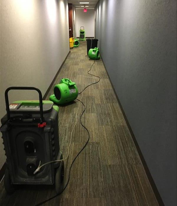 Hallway with SERVPRO drying equipment